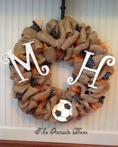 a soccer wreath with the letter m on it