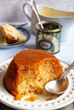 a piece of cake on a plate with a spoon