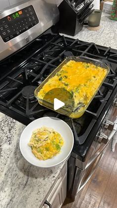 an omelet is being cooked on the stove with a white bowl next to it