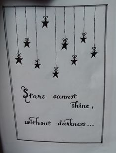 a sign with stars hanging from it's sides that says, stars cannot shine without darkness