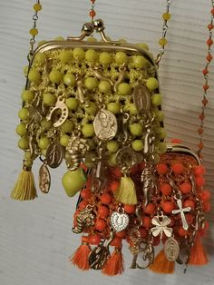 Wonderful autenthic 1970 beaded purse, absolutely perfect condition, pretty italian good luck charms,only 2,you can wear like necklace.. 2 front.. One whit charms, the other simple..only 2