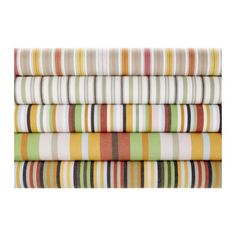 a stack of multicolored sheets on top of each other in different sizes and colors