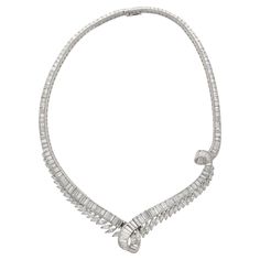 Platinum choker necklace, weighing 75.70 grams and measuring 14 inches. The necklace showcases a total of 193 Diamonds in three different cuts: 41 marquise-cut diamonds, and 152 baguette-cut diamonds. All bearing eye-clean clarity and F-G color. The necklace boasts an impressive 40 carats total (approx.) of dazzling diamonds. Handcrafted with a stunning overlapping floral motif that sits beautifully around the neck. Item Details: - Type: Choker Necklace - Metal: Platinum - Weight: 75.70 Grams - Luxury Platinum Baguette Cut Diamond Necklace, Luxury Platinum Baguette Diamond Necklace, Luxury Baguette Cut Dazzling Necklace, Luxury Baguette Diamond Necklace For Formal Events, Luxury Platinum Diamond Necklace With Baguette Diamonds, Magenta Hair, Diamond Chandelier, Baguette Cut, Marquise Cut Diamond