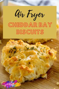 an air fryer cheddar bay biscuits on a cutting board with text overlay