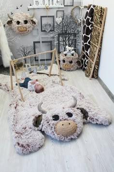 an animal themed room with stuffed animals on the floor