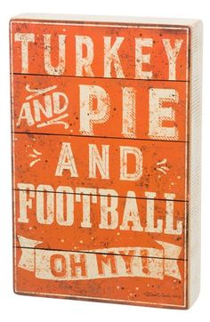 a wooden sign that says turkey and pie and football on it