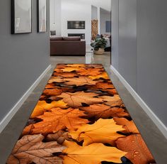 the hallway is decorated with colorful leaves on the floor and rugs in front of it