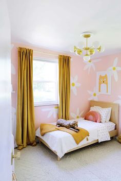 a bedroom with pink walls and yellow curtains