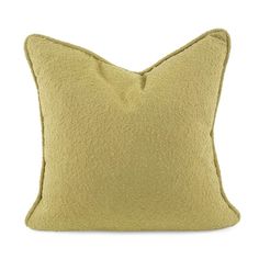 a light green pillow with a square shape on the front and back, sitting on a white background