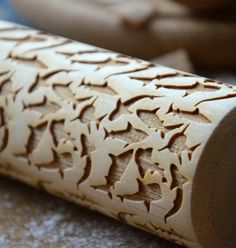 an intricate carved piece of wood sitting on top of a table