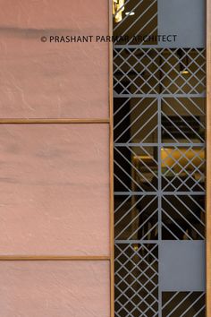 a cat is sitting on the window sill in front of a building with a sign that says prashant park district