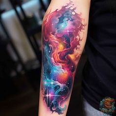 a person with a colorful tattoo on their arm and the space behind them is shown