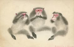 three monkeys sitting next to each other