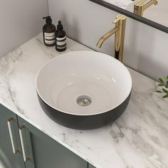 a bathroom sink sitting on top of a white counter