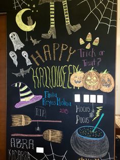 a chalk board with halloween writing on it