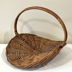 This large wicker basket with handle is perfect for any flower gathering enthusiast. Its size makes it ideal for collecting a variety of flowers, while the handle allows for easy transport. The charming French style design adds a decorative touch, making it a great addition to any collection of decorative collectibles. Crafted for durability, this basket is perfect for all types of gathering activities. Its sturdy construction ensures that it can withstand daily use, making it an ideal choice for those who enjoy spending time outdoors. The basket's features include a handle for easy carrying, and a classic woven design that adds an elegant touch to any setting. The basket has minor signs of wear from age/use. It measures approximately 19.75" x 17" x 15" tall. Homemade Baskets, Gathering Activities, Thrift List, Antique Baskets, Mid Century French, Large Wicker Basket, Gathering Basket, Variety Of Flowers, Basket With Handle