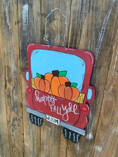 a sign that says happy fall y'all welcome on the side of a wooden fence