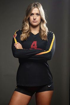 a woman posing for a photo with her arms crossed