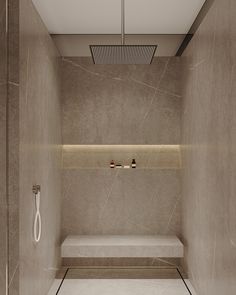 a bathroom with a bench and shower head