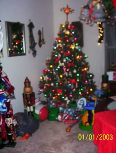 a christmas tree is in the corner of a room