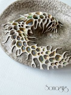 a ceramic dish with an intricate design on it