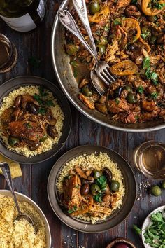 an overhead view of various food dishes on a table with wine glasses and utensils