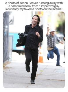 a man running down the street with a camera in his hand and another person walking behind him