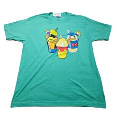 a green t - shirt with cartoon characters on it