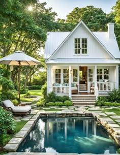 a small white house with a pool in the yard