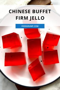 red jello cubes on a white plate with the words chinese buffet firm jello