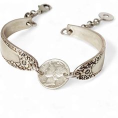 our bracelets are created from vintage silver plated flatware pieces pulled from our extensive juNxtaposition silverware collection adorned with a vintage dime . we keep our designs 'vintage looking' which means they have a slight amount of tarnish, however, if you prefer the bright silver look, you are welcome to bring up their 'shine' with your own silver polish . our bracelets are a standard measurement of 7 1/2" some have magnet attachements, while some have a lobster claw for better size ad Silver Coin Bracelet, Key Bracelet, Stamped Necklaces, Coin Bracelet, Silver Bling, Bee Pendant, Silver Polish, Owl Pendant, Key Pendant