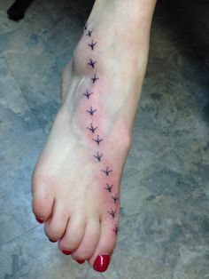 a woman's foot with small stars on it