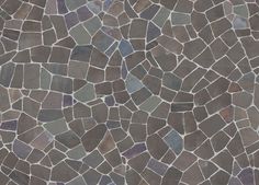 a close up view of a tile floor with brown and blue colors on it's surface