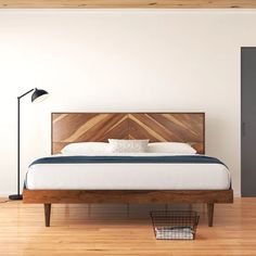 a bed sitting on top of a hard wood floor