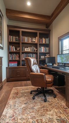 an office with a desk, chair and bookshelf full of books in it