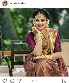 a woman sitting on top of a swing wearing a gold and red outfit with jewelry