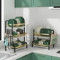 a kitchen with green cabinets and white countertops has dishes stacked on metal racks in front of the sink