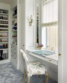 a white dressing room with a desk and chair