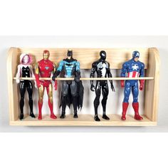 six action figures are lined up on a shelf in the shape of captain america, iron man, and spider - man