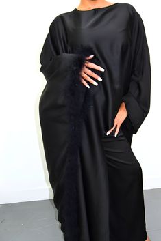 Embrace timeless elegance with our exquisite Satin Abaya Co-Ord Set. This stunning two-piece ensemble features a luxurious, soft-flowing satin fabric that drapes beautifully and flatters your figure. The elegant abaya boasts a modest silhouette, perfect for everyday wear or special occasions. The highlight of this set is the exquisite fur trim. This touch of luxury adds a touch of sophistication and warmth to the design, making it perfect for cooler evenings or formal events. Key Features Luxurious Satin Fabric: Experience the soft, smooth feel of premium satin that flatters your form. Elegant Abaya Silhouette: This modest design offers full coverage while maintaining a stylish and graceful drape. Delicate Fur Trim: Elevate your look with a touch of luxury and warmth. Two-Piece Co-Ord Set: Formal Long Sleeve Silk Abaya, Luxury Long Sleeve Evening Abaya, Elegant Long Sleeve Wedding Niqab, Elegant Floor-length Abaya For Eid, Luxury Long Abaya, Luxury Long Abaya For Formal Occasions, Elegant Satin Maxi Abaya, Elegant Long Niqab For Eid, Elegant Silk Abaya With Long Sleeves