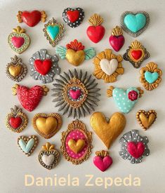 there are many different heart shaped cookies on the table with words above them that read danielle zepeda