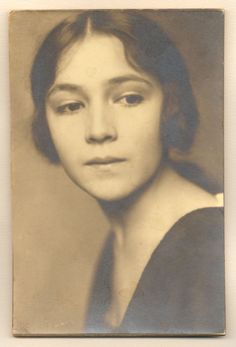 an old black and white photo of a woman