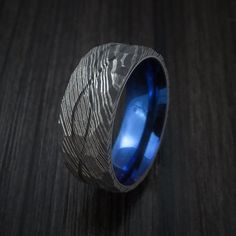 Damascus Steel Hammered Celtic Knot Ring Infinity Design with Anodized Sleeve Wedding Band | Damascus steel, Knot rings and Celtic knots Wedding Rings Infinity, Rings Infinity, Blue Wedding Rings, Unique Wedding Rings, Damascus Ring, Damascus Steel Ring, Infinity Design, Celtic Knot Ring, Celtic Wedding Rings