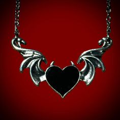 Devil’s heart necklace is the perfect spooky accessory to wear if you love to glamour your dark side! Pair this with our sterling silver bat wing ring to make the perfect accessory combo! material: zinc alloy 20” chain Silver Emo Jewelry For Halloween, Emo Metal Jewelry For Halloween, Emo Jewelry With Adjustable Chain For Parties, Gothic Winged Jewelry Gift, Gothic Winged Jewelry For Gifts, Emo Metal Jewelry With Adjustable Chain, Silver Emo Necklace For Party, Edgy Sterling Silver Jewelry For Halloween, Edgy Jewelry For Halloween Gift