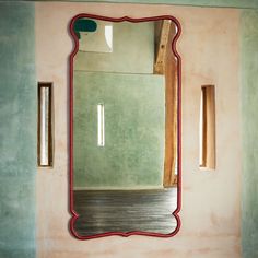 a bathroom with a large mirror on the wall