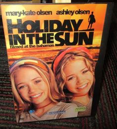 the dvd cover for holiday in the sun, which features two young women with blonde hair