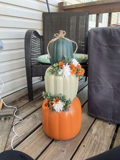 an orange and white pumpkin sitting on top of a wooden table