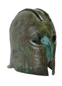 a bronze helmet with an eye on it