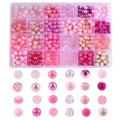 pink and white beads are arranged in a plastic tray with different shapes, sizes and colors