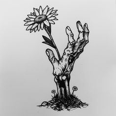 a black and white drawing of a hand reaching for a sunflower on the ground